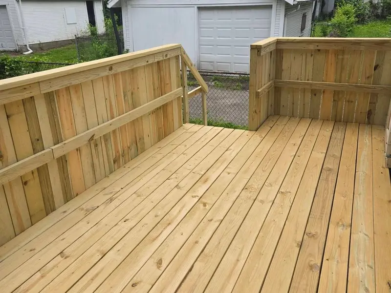 Rebuilt wood deck with new decking boards and railings